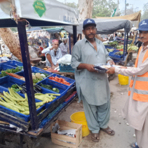 14-06-2025 – To help vendors combat the heat, 1 unstitched suit, a Nighaban cap, and ORS were provided to each thela owner. (1)